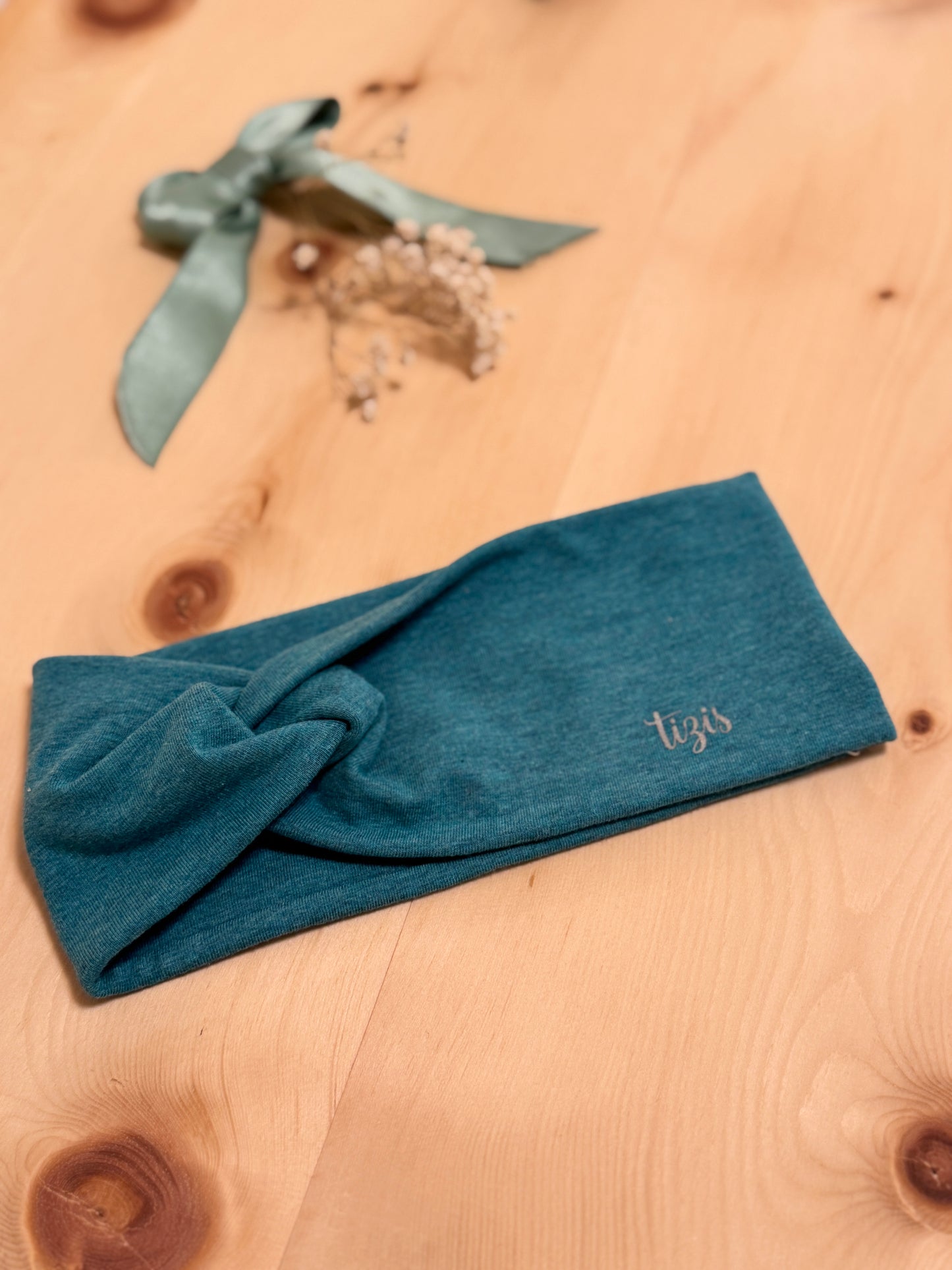 Knotenstirnband petrol melange Optik